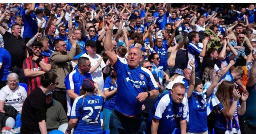 Ipswich Town supporters celebrate their promotion to the Premier League.